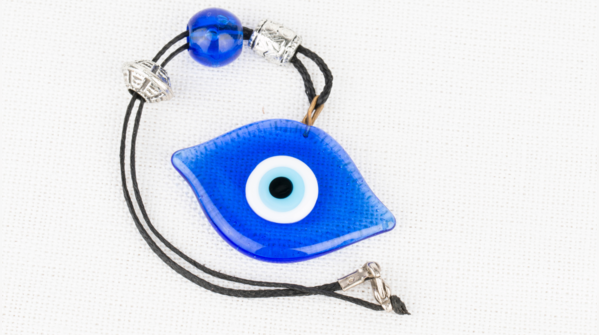 A broken Evil Eye amulet, symbolizing protection fulfilled.