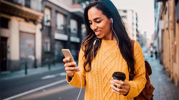 Holding phone with one hand, scrolling with the same thumb.